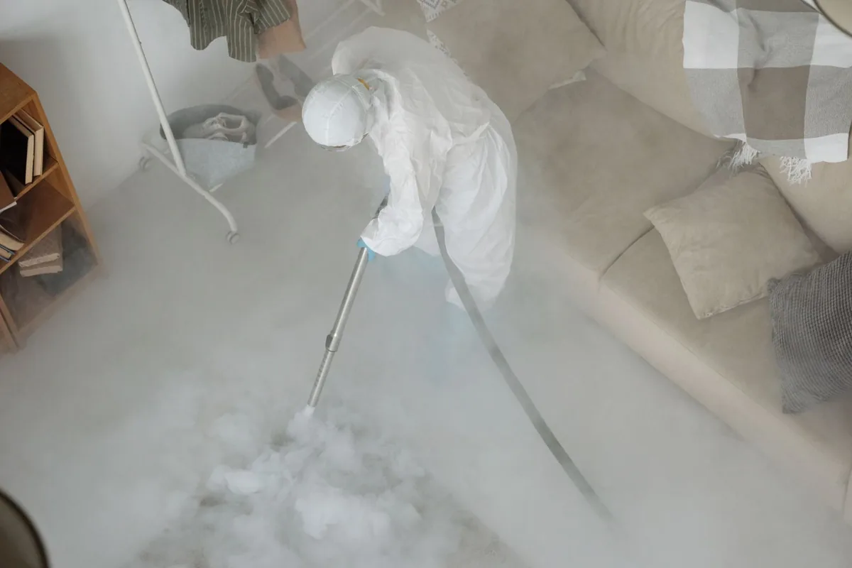 Biohazard cleanup technician in protective equipment, Cornish, ME